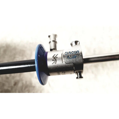 Silver and blue surgical endoscope with circon branding on metallic body of circon acmi sheath esrs-28 with etor-28 obturator