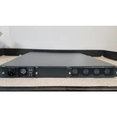 Black cisco 5500 series wireless lan controller model 5508 back with ventilation grilles and dual ac power ports