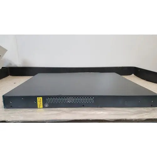 Black rectangular cisco 5500 series wireless lan controller model 5508 with perforated front panel and yellow warning label