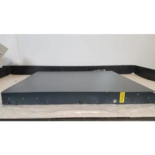 Black metal CISCO 5500 series wireless LAN controller model 5508 with matte finish and yellow warning label on the side