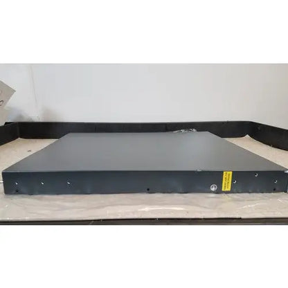 Black metal CISCO 5500 series wireless LAN controller model 5508 with matte finish and yellow warning label on the side