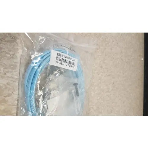 Light blue coiled cable in clear plastic packaging for cisco 5500 series wireless lan controller model 5508