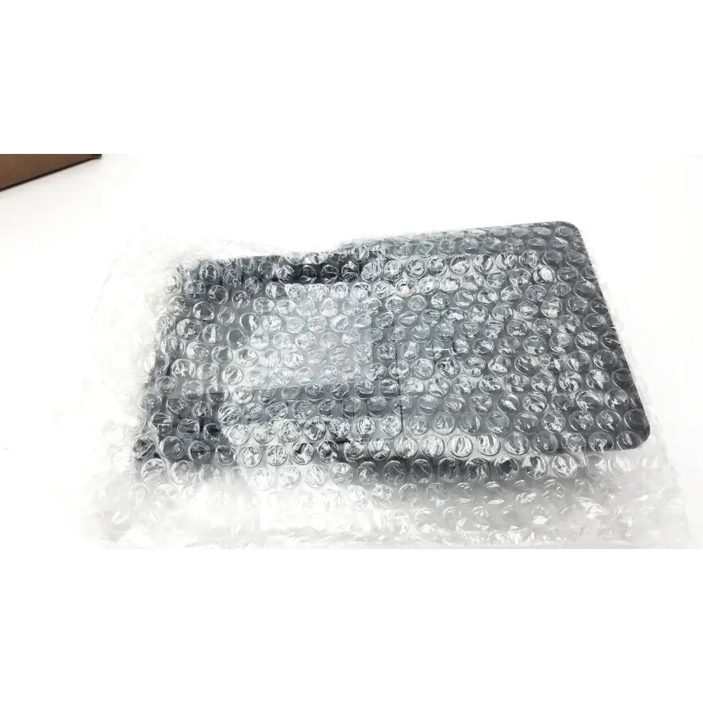 Black rectangular cisco ip phone key expansion module wrapped in clear bubble wrap for easy protection and shipping