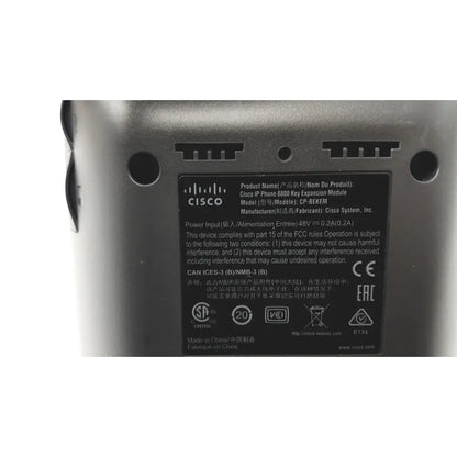 Gray cisco ip phone 8800 key expansion module with black label showing specifications and certifications on the back side