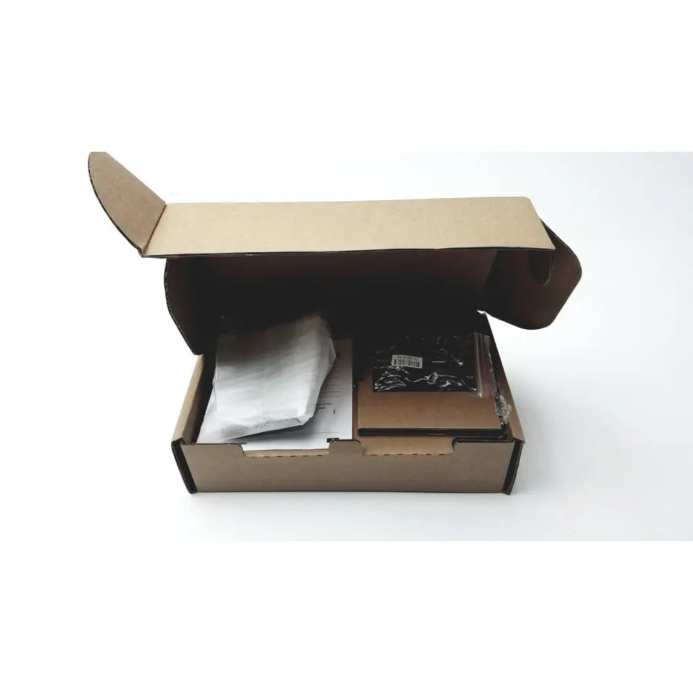 Brown cardboard box with flaps open containing wrapped cisco ip phone key expansion module and black plastic bag