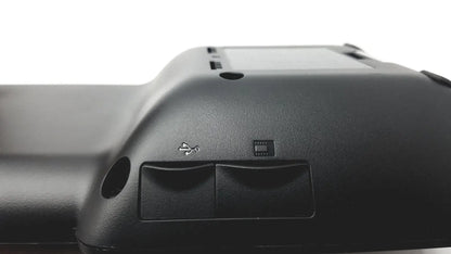 Black plastic cisco ip phone key expansion module back side showing usb port and memory card slot for enhanced functionality