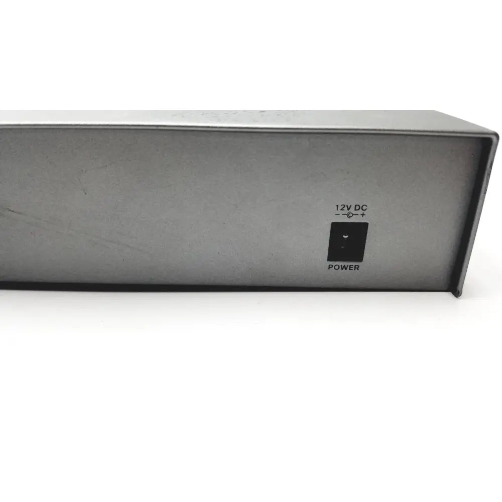 Gray metal power supply unit with black power switch and 12v dc indicator on the back of cisco sf300-8 managed switch
