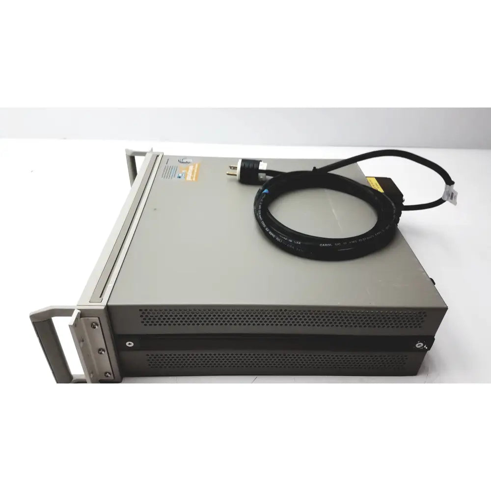 Gray metal cisco wae 600 series server rack with coiled black power cable for wide area application engine use