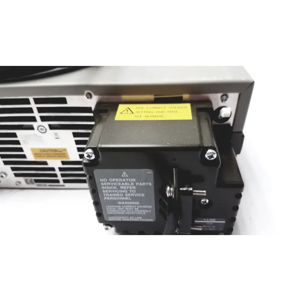 Black industrial power supply unit with warning labels and ventilation slots on the back of cisco wae 600 series wide area application engine