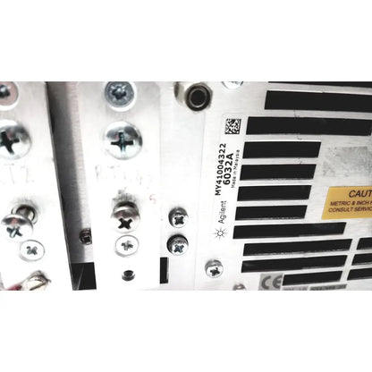 Silver metallic industrial panel of cisco wae 600 series server with agilent label and ventilation slots on back side