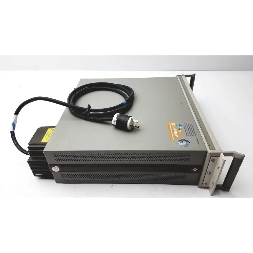 Gray metal cisco wae 600 series server rack with black power cable and yellow warning label for wide area application engine