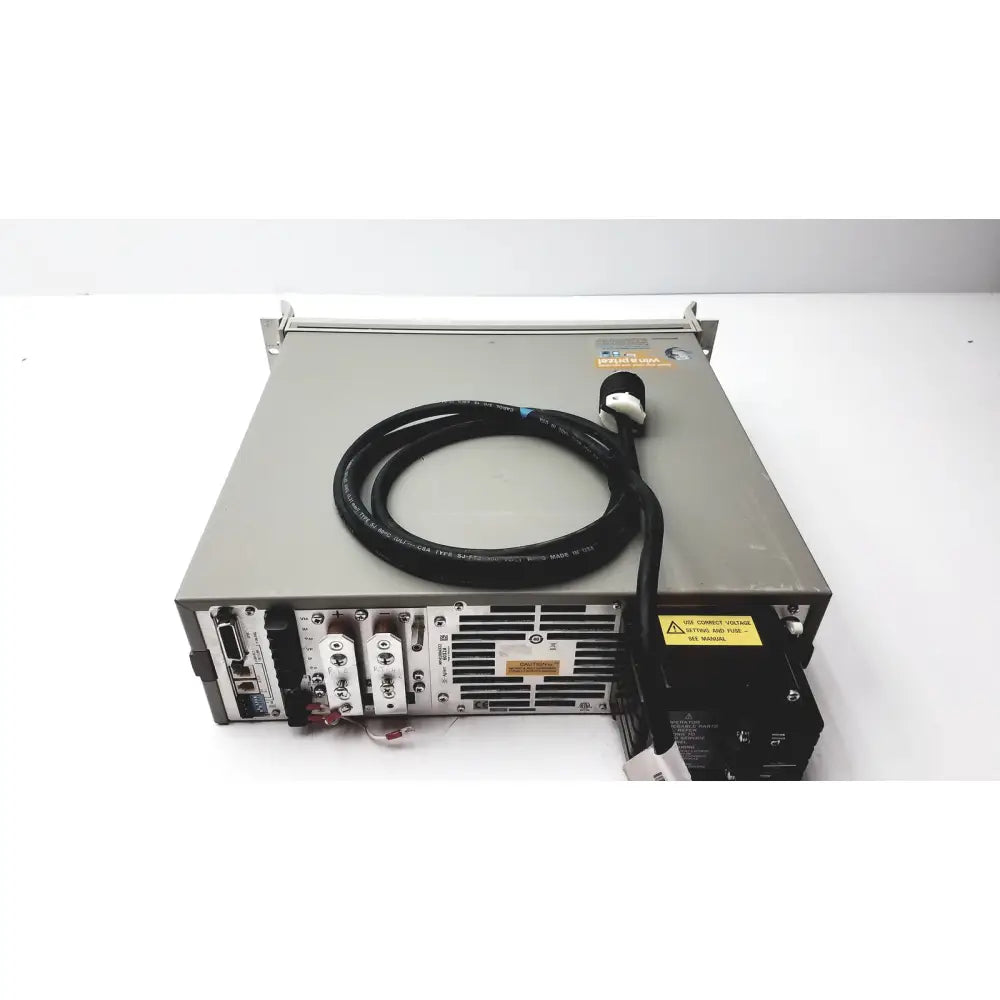 Back side of gray metal cisco wae 600 series server rack with black coiled cable and wide area application engine ports