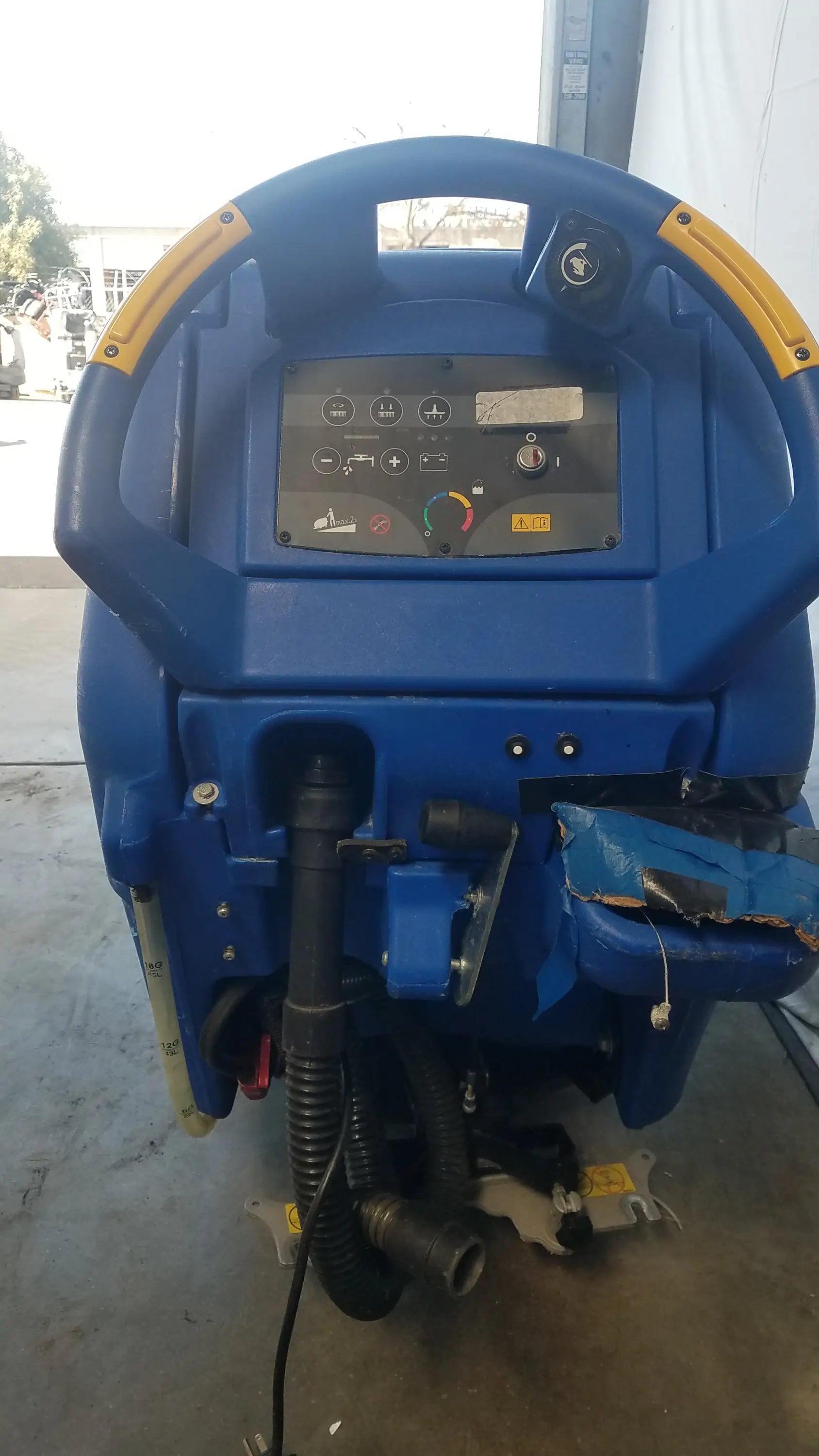 Blue industrial floor scrubber focus ii boost with yellow accents and control panel for efficient floor cleaning machine use