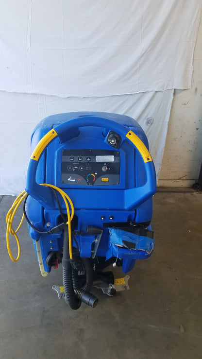 Blue clarke focus ii boost 28 floor scrubber with yellow handlebars and hoses is an efficient floor cleaning machine