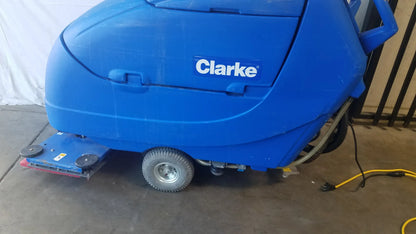 Blue Clarke focus ii boost floor scrubber with rounded plastic body and small wheels for efficient floor cleaning machine use