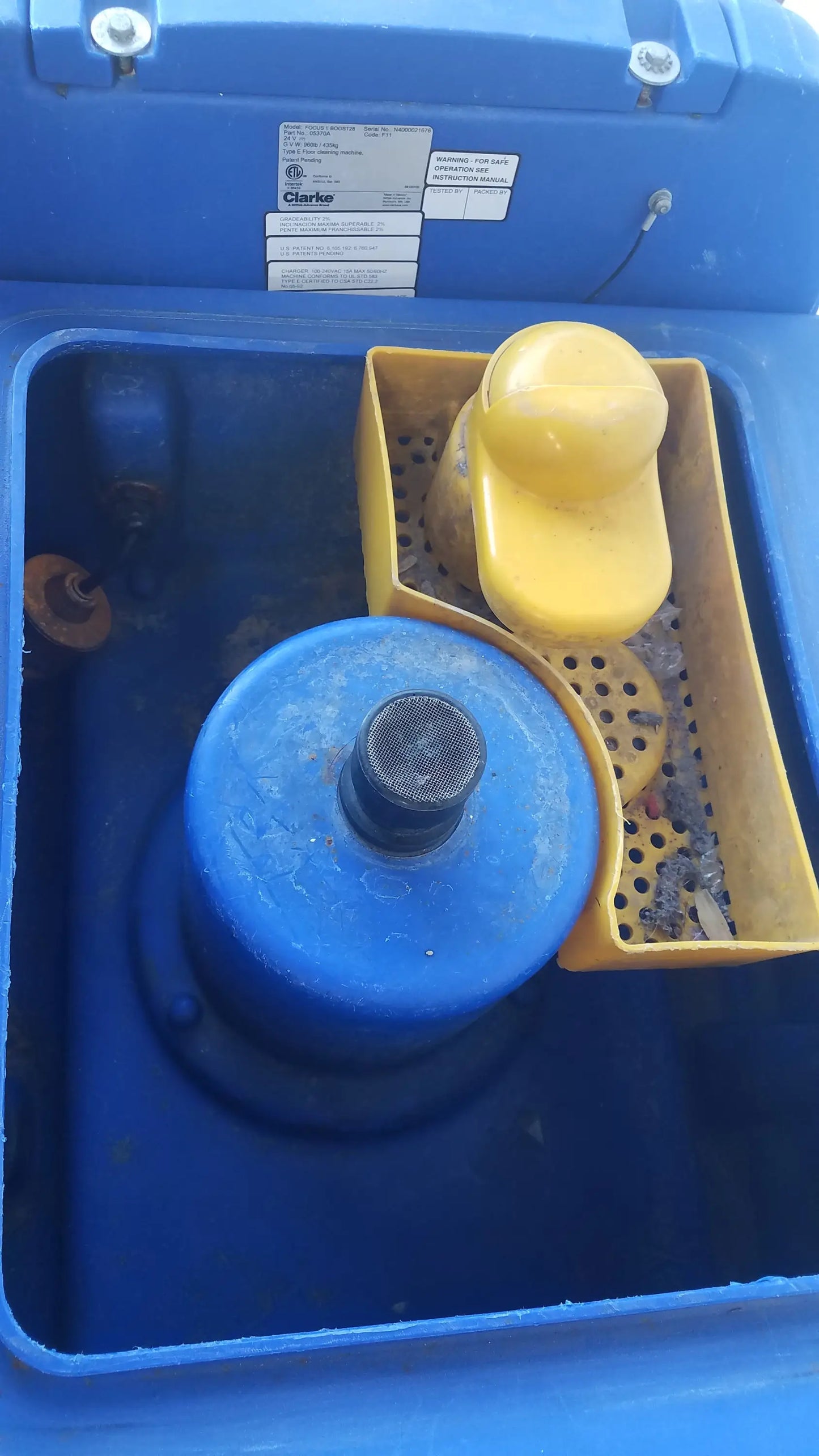 Blue plastic pool cleaner with yellow filter housing and black mesh top for clarke focus ii boost floor scrubber