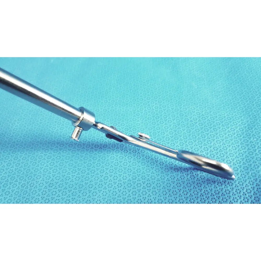 Shiny metallic claw gasper 10mm surgical instrument with long slender handle and articulated joint for precise use