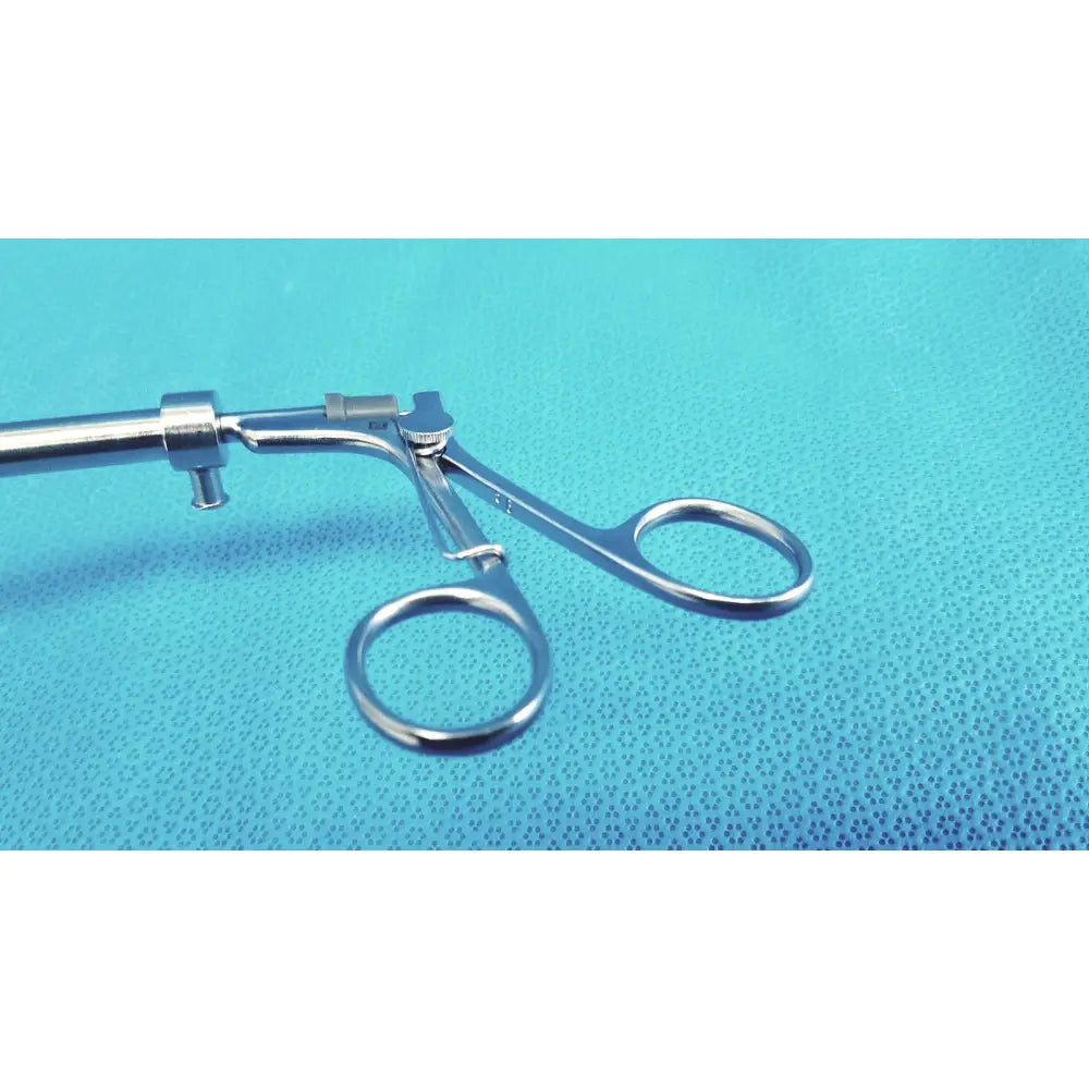 Silver surgical claw gasper 10mm with polished metallic finish and ergonomic circular handles for precision use