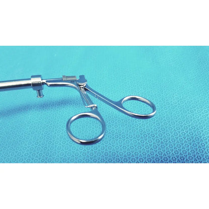 Silver surgical claw gasper 10mm with polished metallic finish and ergonomic circular handles for precision use