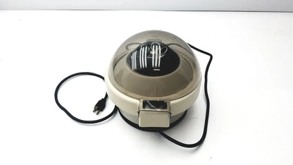 Beige and translucent dome-shaped clay adams roche model 0171 analytical centrifuge with black power cord