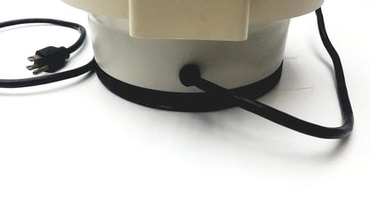 Cream-colored cylindrical fan base with black power cord and plug of clay adams roche model 0171 analytical centrifuge