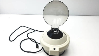 Cream-colored clay adams roche model 0171 analytical centrifuge with transparent dome lid and black rotor chamber