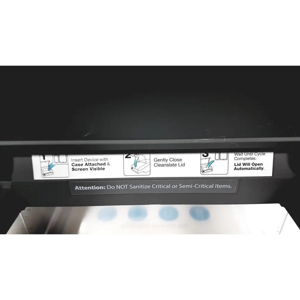 Black plastic instruction label with white text and diagrams for cleaning on the back of CleanSlate UV csuv-ug6cx mobile device sterilizer
