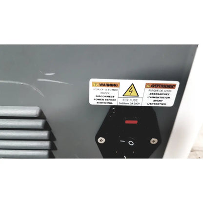 Black power switch with red indicator and silver screws on gray panel of cleanSlate UV csuv-ug6cx mobile device sterilizer