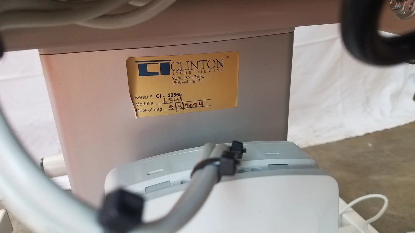 Beige clinton 6341 power series blood drawing chair with yellow clinton industries inc label and handwritten model number