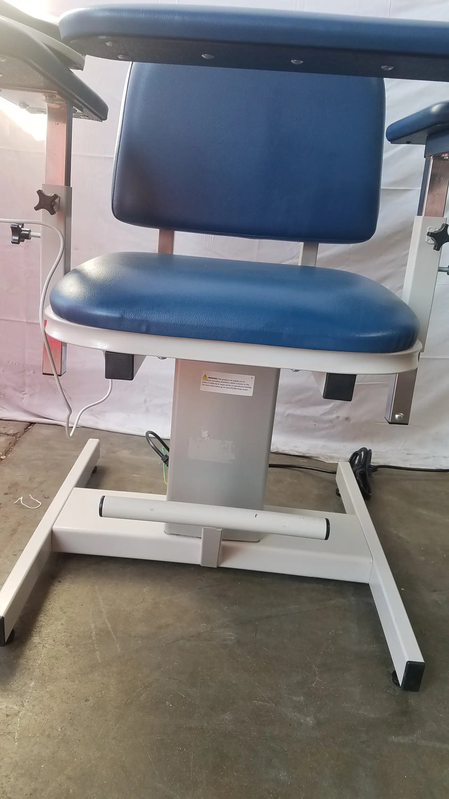Clinton 6341 power series blood drawing chair with blue padded seat white metal frame and adjustable height mechanism