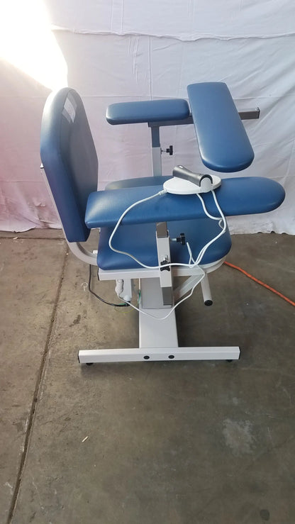 Blue padded clinton 6341 power series blood drawing chair with adjustable armrests and white metal frame