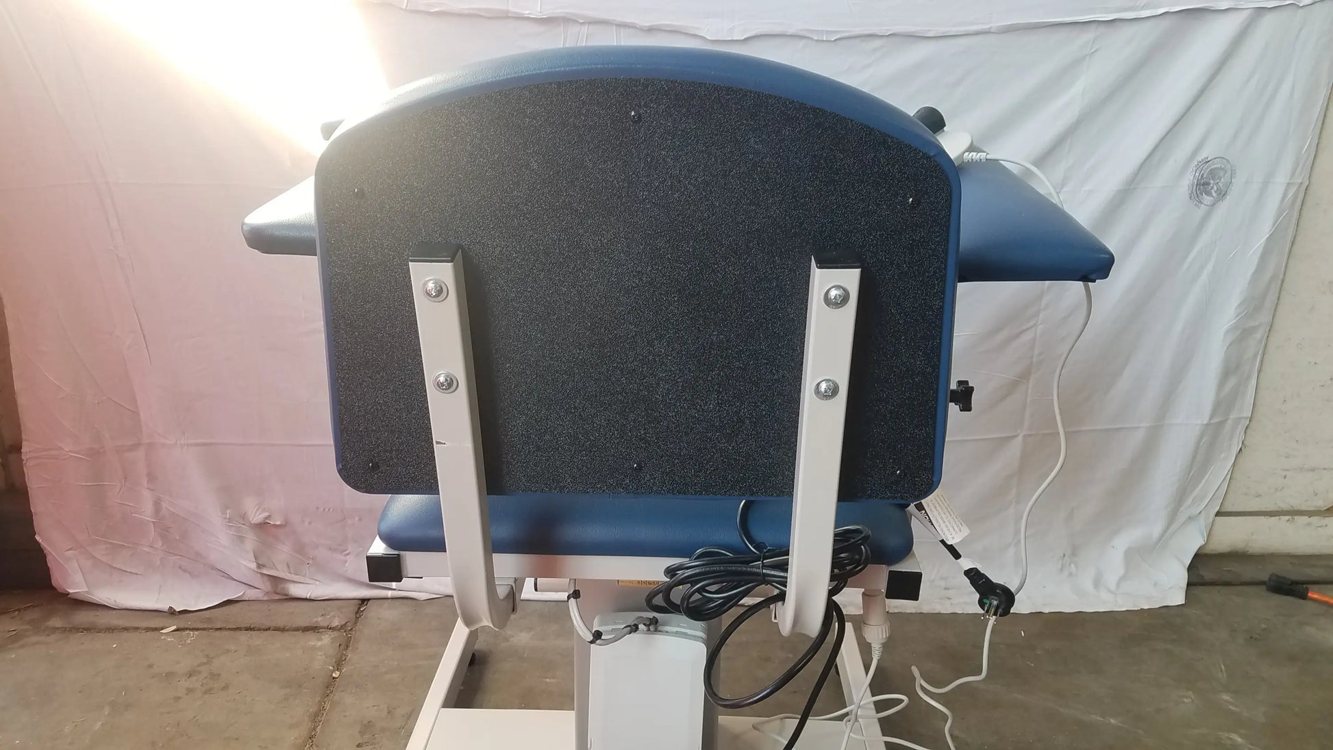 Blue padded power series blood drawing chair with black textured backrest and silver metal frame for blood drawing