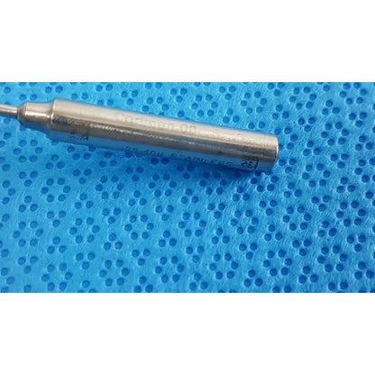 Silver cylindrical metal probe engraved copper-60 stainless steel on blue surface from codman debakey mall surgical set