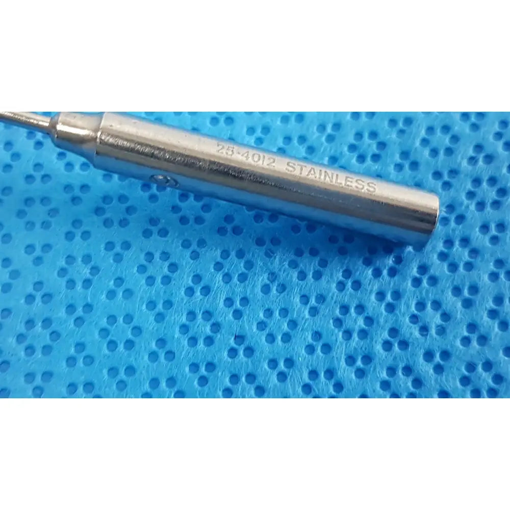 A sleek metallic cylindrical tool engraved 25-4012 stainless from the codman debakey mall surgical instrument set