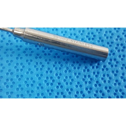 A sleek metallic cylindrical tool engraved 25-4012 stainless from the codman debakey mall surgical instrument set