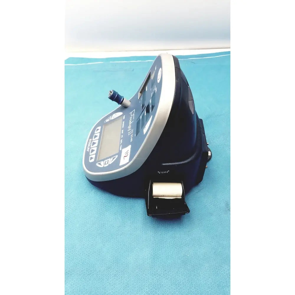 Blue and silver handheld colin press-mate prodigy ii 2240 patient monitor with digital display, control buttons, and cuff attached