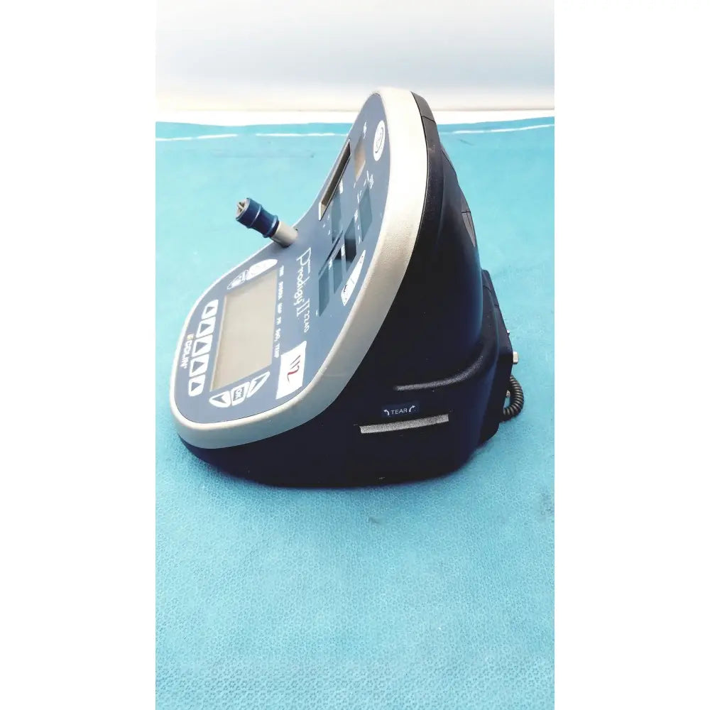 Blue and gray handheld colin press-mate prodigy ii 2240 patient monitor with digital display control buttons and cuff attachment