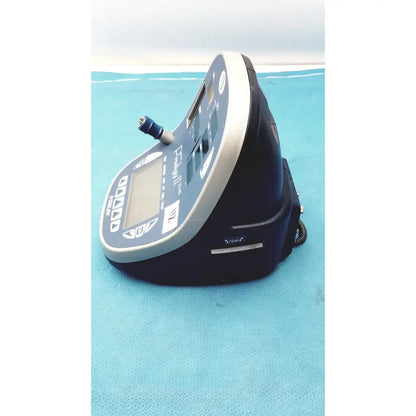 Blue and gray handheld colin press-mate prodigy ii 2240 patient monitor with digital display control buttons and cuff attachment