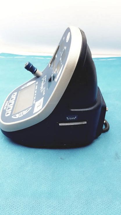 Black and silver medical-grade patient monitor colin press-mate prodigy ii 2240 with digital display and coiled cable