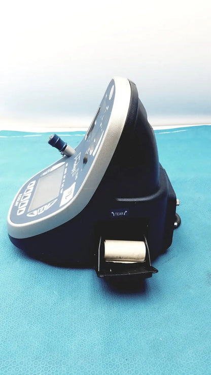 Black and silver colin press-mate prodigy ii 2240 patient monitor with digital display and paper roll for medical use