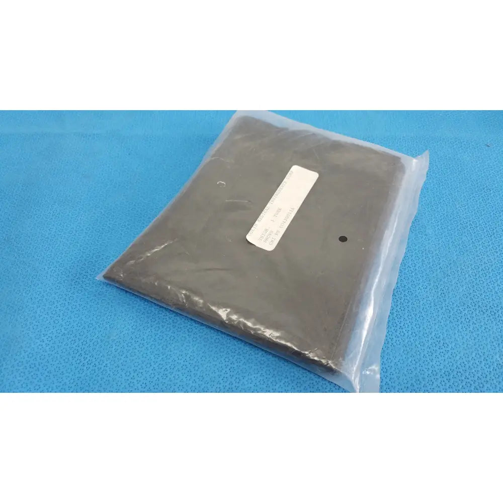 Dark gray colin v-lok co430011a thigh blood pressure cuff 1-tube wrapped in clear plastic with white label and corner hole