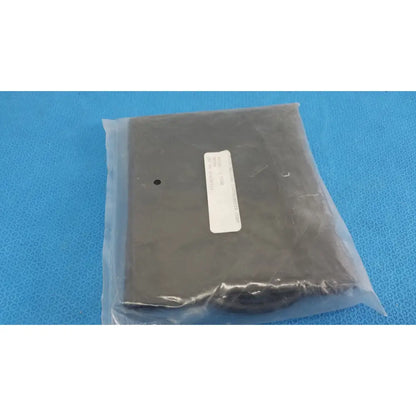 Black rectangular electronic component sealed in clear bag with white label for colin v-lok thigh blood pressure co430011a