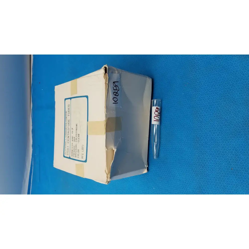 Clear plastic conical centrifuge tube with white label number 10857 featuring colored graduations and beaded rim