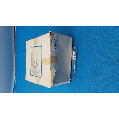 Clear plastic conical centrifuge tube with white label number 10857 featuring colored graduations and beaded rim