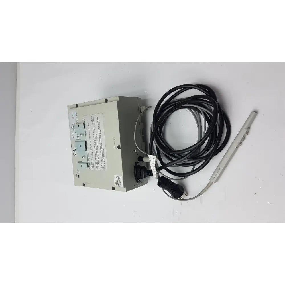 Gray rectangular Conmed 2000 medical equipment with coiled black cable and slender gray probe for reuse medical applications