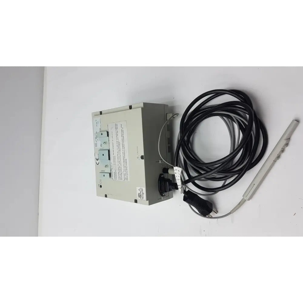 Gray rectangular conmed 2000 unit industrial temperature controller with black coiled cable and sensor probe for reuse medical equipment