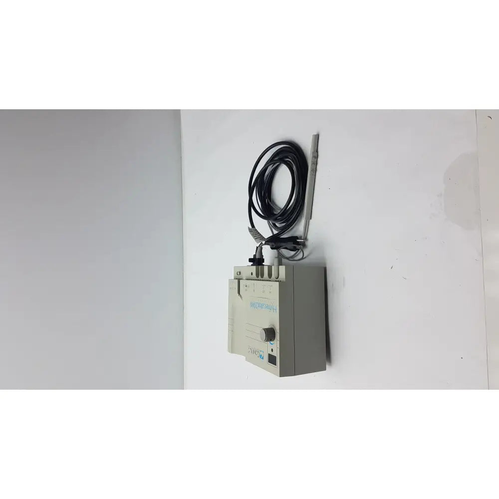 Gray rectangular Conmed 2000 unit medical equipment with coiled black cable and thin metallic probe for reuse medical applications