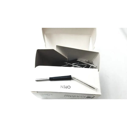 Silver paperclip opener with black handle resting on white packaging of conmed hyfrecator reuse medical electrosurgical system accessories