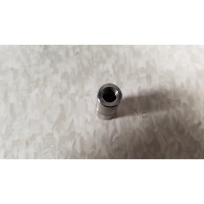 Silver metallic cylindrical connector with threaded interior on the back side of conmed im4123 true hd 1080p urology camera head