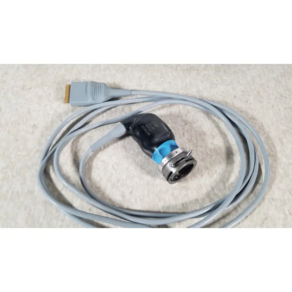 Gray coiled cable with black and blue conmed im4123 true hd 1080p autoclavable 90° urology camera head connector with metallic ring